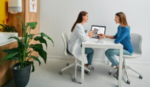 A gynecologist is consulting with a female patient to discuss menopause treatment options.